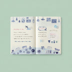 Open notebook with illustrated pages and text on a light green background