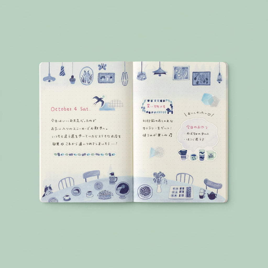 Open notebook with illustrated pages and text on a light green background