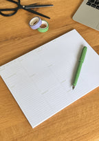 nóta póca A4 weekly desk pad white and green flat lay