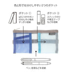Midori blue pen case with pen inserted on book