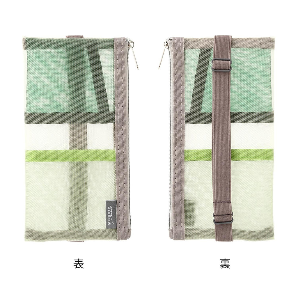 Midori green pen case with pen inserted on book