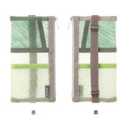 Midori green pen case with pen inserted on book