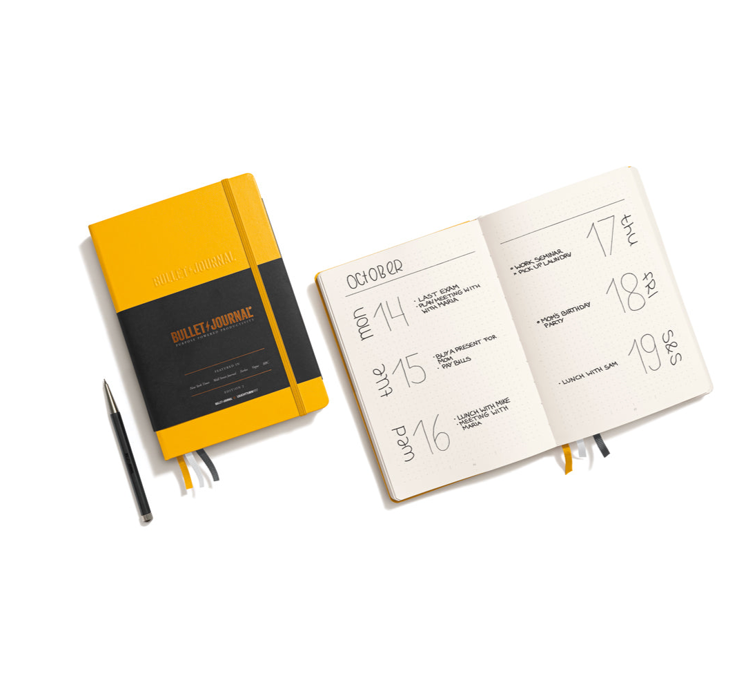 Leuchtturm1917 yellow Bullet Journal open showing dotted pages