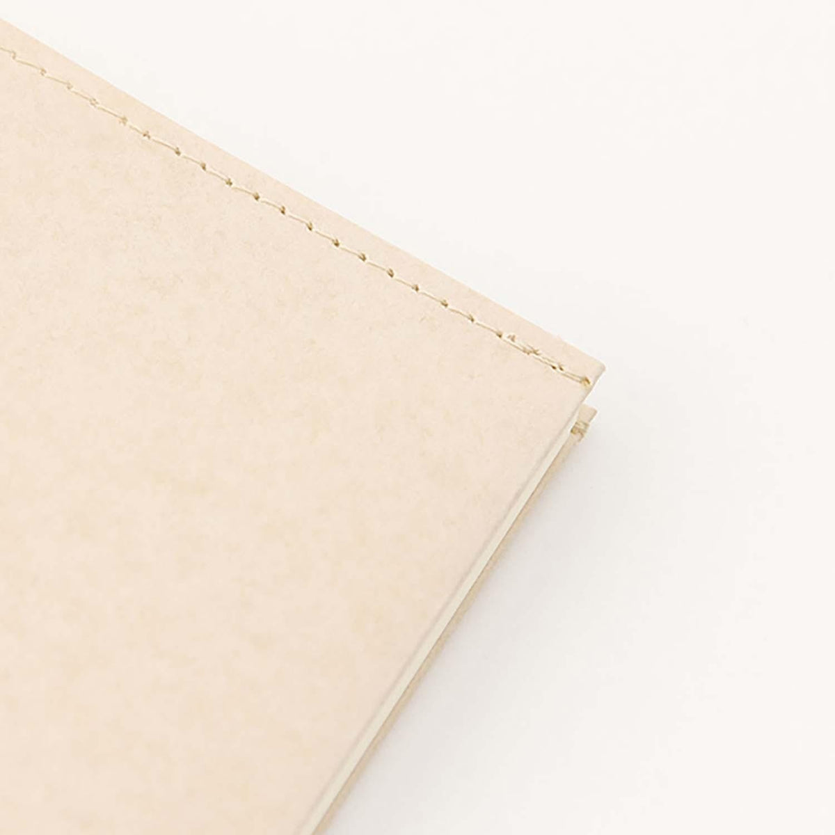 Midori MD Paper leather effect A5 cover on notebook front