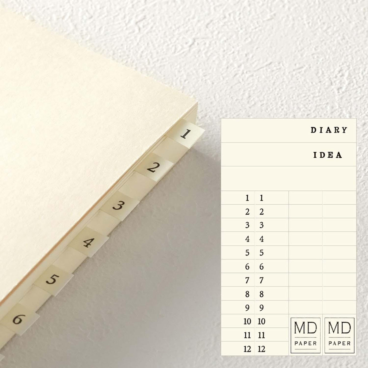Midori MD Paper daily journal with pen writing on page