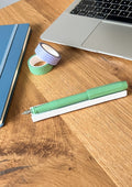 nóta póca single pen rest holding one fountain pen on desk