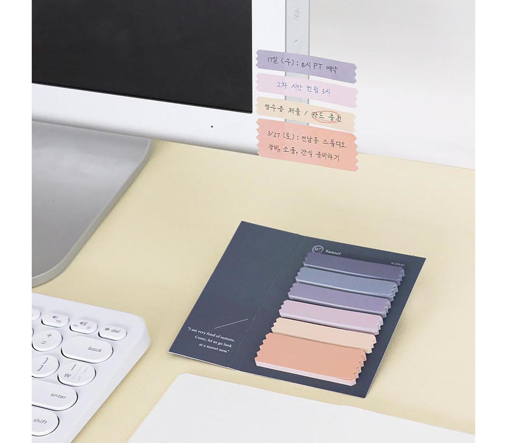 Iconic sunset sticky notes in use on notebook pages
