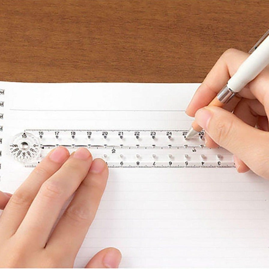 Midori 30cm clear ruler in use on paper