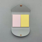 Navy sticky notes cover open showing coloured pages