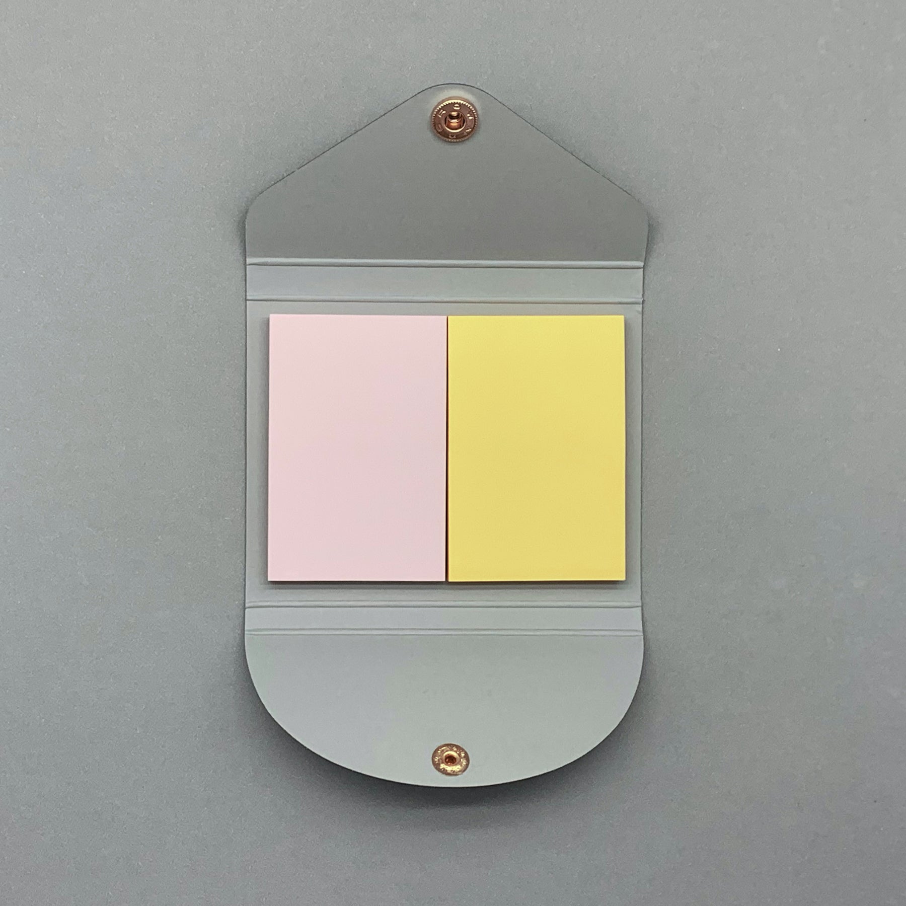 Navy sticky notes cover open showing coloured pages